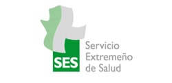 Logotipo del servicio extremeño de salud (SES), que presenta una cruz estilizada de color verde y blanco con el texto "servicio extremeño de salud" en gris y verde, que marca el inicio de la atención sanitaria integral.